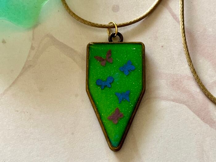 Necklace- Misa Cornus Drop Pendant with Beige Cord Chain- Green base, Pink &  Blue Butterflies - Image 2